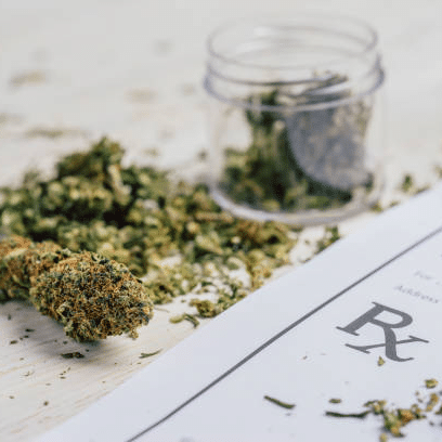 marijuana in jar next to RX paper