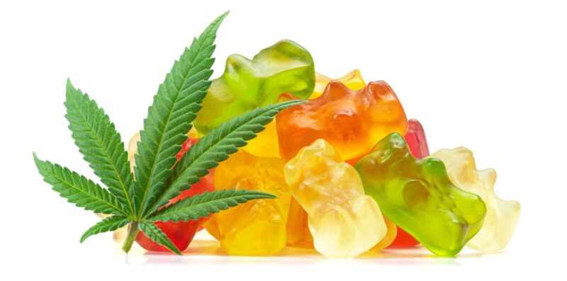 Gummy Bear Medical Marijuana Edibles, Candies Infused with CBD or THC, with Cannabis Leaf Isolated on White Background